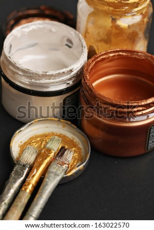 Brushes and paint jars