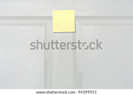 note on white door