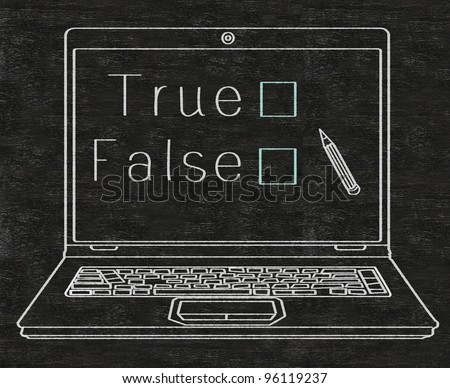 true or false choice on computer screen written on blackboard