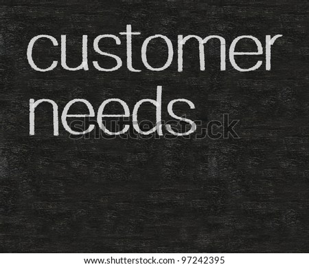 customer needs business written on blackboard background