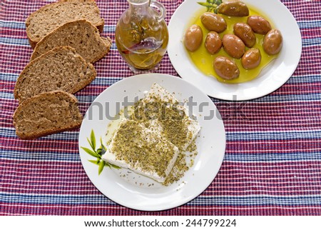 Traditional Greek salad with feta cheese, bread and Greek olives