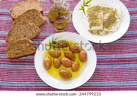 Traditional Greek salad with feta cheese, bread and Greek olives