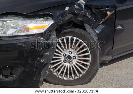 Generic compact car damaged in a rollover accident. Car crash wreck - insurance concept