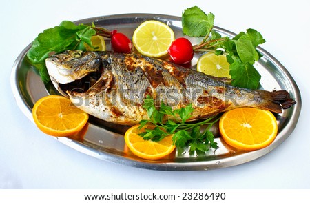 Cooked fish with lemons