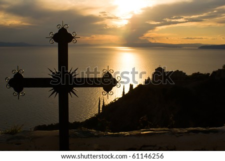 Cross at sunset on Mount Athos, Greece