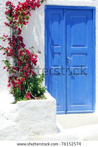 Old door and flowers on Santorini island, Greece