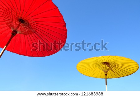 Thai traditional umbrella with clear blue sky