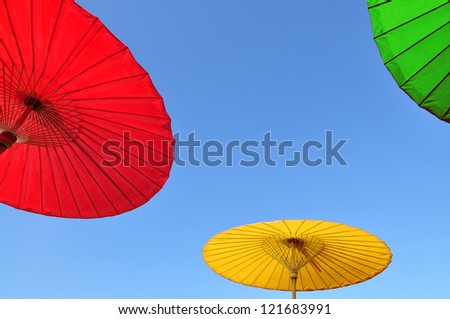 Thai traditional umbrella with clear blue sky
