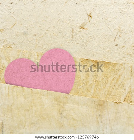 heart recycled paper stick on paper background