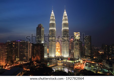 KUALA LUMPUR - August 22: The Petronas Twin Towers on August 22, 2013, in Kuala Lumpur, Malaysia are the world\'s tallest twin tower. The skyscraper height is 451.9m