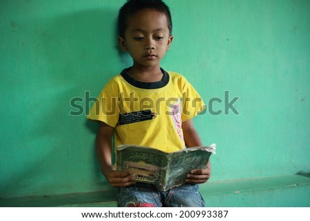 DIENG PLATEAU, JAVA, INDONESIA - SEPT 15, 2012. : Unidentified kid at school, This land height above sea level 2,000 meters Javanese ancient belief that the Plateau is the land of gods.