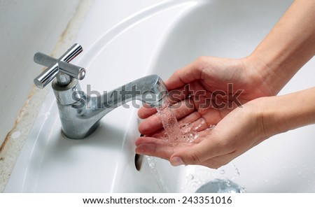 Washing Hands , Hygiene. Cleaning Hands. Washing hands under running water in a sink