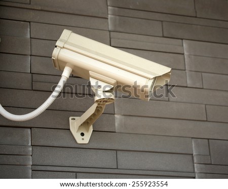 CCTV camera. Security camera on the wall. Private property protection.