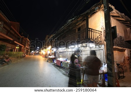 Loei, THAILAND - Mar 9: Unidentified old house and people on a walking Street on Mar 9, 2015 in Chaing Khan,Loei. Walking Street is a popular attraction. Almost 20 million tourists visited Thailand .