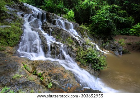 Deep forest waterfall , The waterfall named Mae Phlu  waterfall in  Uttaradit province ,  Thailand