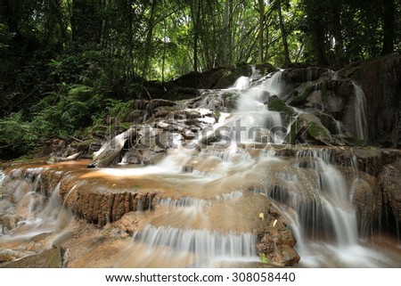 Paradise waterfall in Tropical rain forest of Thailand , water fall in deep forest at Tak province Thailand . The waterfall named Pha Charoen waterfall