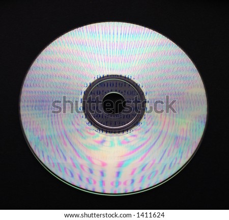 A CD on black background reflecting ones and zeros. Contain embedded clipping path.