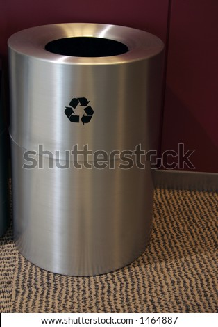 Stainless steel recycle bin with recycling sign on the side. Includes a clipping path.
