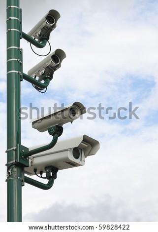 Surveillance security video camera on cross road