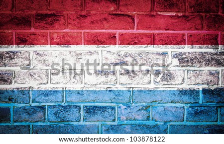 Collection of european flag on old brick wall texture background, Luxembourg