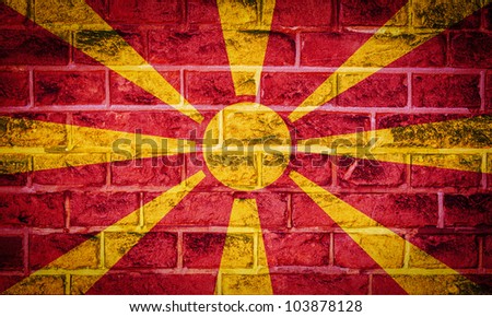 Collection of european flag on old brick wall texture background, Macedonia