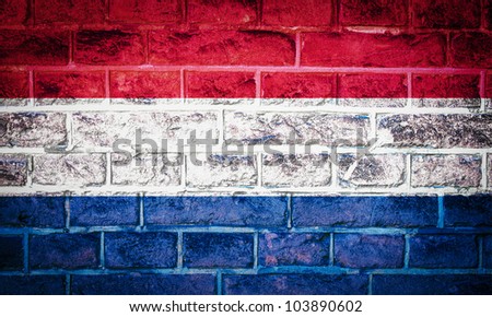 Collection of european flag on old brick wall texture background, Netherlands