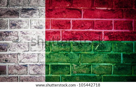 Collection of european flag on old brick wall texture background, madagascar