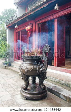 Chinese incense burner and traditional temple.