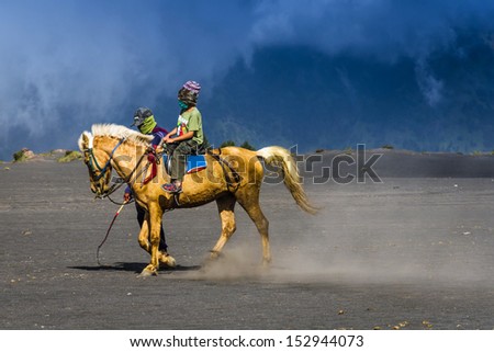 EAST JAVA,INDONESIA-MAY 05 : Tourists ride the horse at Mount Bromo, The active volcano is one of the most visited tourist attractions on May 05,2013 in East Java, Indonesia.