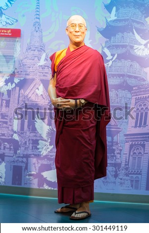 BANGKOK -JULY 22: A waxwork of Dalai Lama on display at Madame Tussauds on July 22, 2015 in Bangkok, Thailand. Madame Tussauds\' newest branch hosts waxworks of numerous stars and celebrities