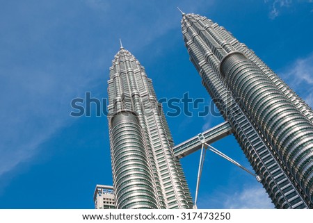 KUALA LUMPUR,MALAYSIA - JULY 11, 2009: The Petronas Towers,Petronas Twin Towers are twin skyscrapers in Kuala Lumpur, Malaysia. Malaysia.Malaysia is a member of Asean Economic Community (AEC)