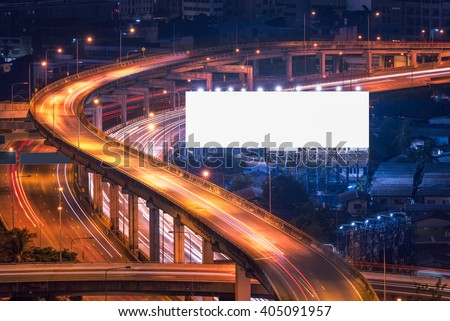 Blank billboard ready for new advertisement at Motorway, Expressway, Freeway in modern city downtown, urban view at night time