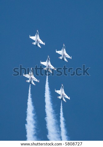 Five US Air Force Thunderbirds flying in formation