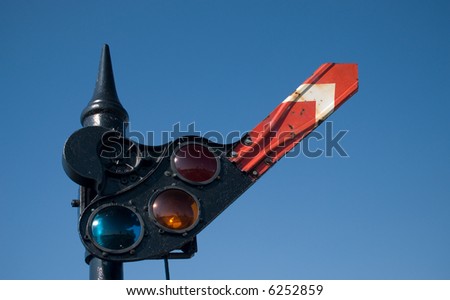 An old railroad stop and go signal, with one arm