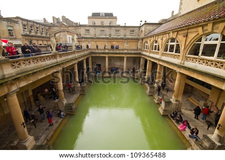 CITY OF BATH, ENGLAND - APR 20: Tourists at the ancient Roman Bath Museum, West England, Apr 20, 2012. The Baths are one of a major tourist attraction in England.