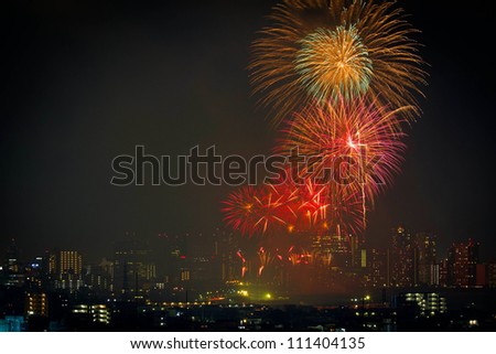 Fireworks over the buildings in Tokyo