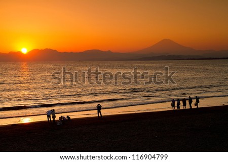 Mt.Fuji-OCTOBER 21: Unidentified Tourist at the beach to see sunset and silhouette of Mt.Fuji on October 21, 2012 Enoshima Japan. Mt.Fuji is the highest mountain in Japan with 3,776.24 m.