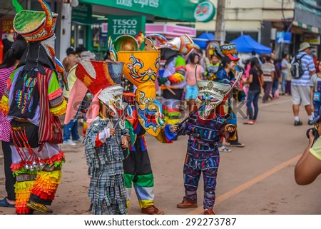 Loei, Thailand - June 27, 2015 : People are dressing with colorful clothes and put the hand made mask which made from wood or threshing bamboo in ghost mask festival or \