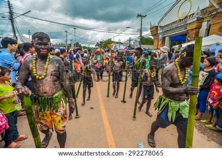 LOEI PROVINCE,THAILAND-JUNE 27:Unidentified men wear ghost costumes at Ghost Festival (Phi Ta Khon - a masked procession celebrated by Buddhist) at Dan Sai district in Loei Province on June 27, 2015.