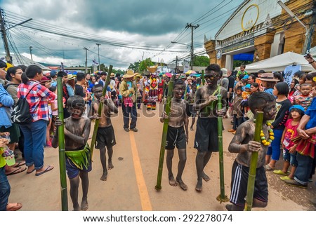LOEI PROVINCE,THAILAND-JUNE 27:Unidentified men wear ghost costumes at Ghost Festival (Phi Ta Khon - a masked procession celebrated by Buddhist) at Dan Sai district in Loei Province on June 27, 2015.