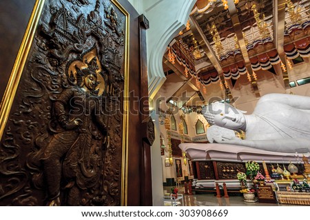 Udonthani, Thailand- October 26,2013: Main chapel of Wat Pa Phu Kon, The biggest white marble nirvana Buddha in Thailand, 20 metres long