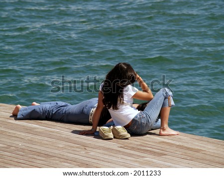 couple resting close to the sea