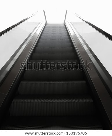 steps of escalator into the light