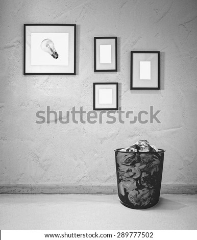 picture of a bulb hanging on the wall and crumpled paper in the bin (choosing the best idea)