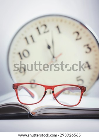 red glasses on the book (stay up late studying)