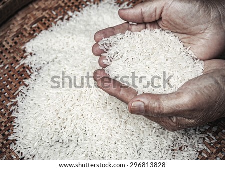 rice in hands of elder