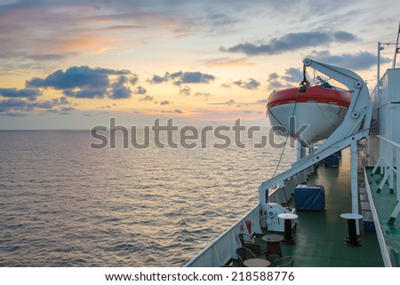 On the open deck of a cruise ship with beautiful sunset