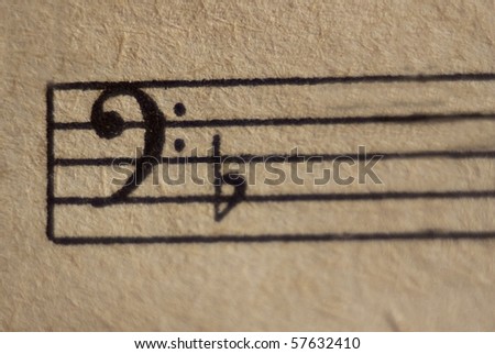 Bass clef with flat on a stave close up