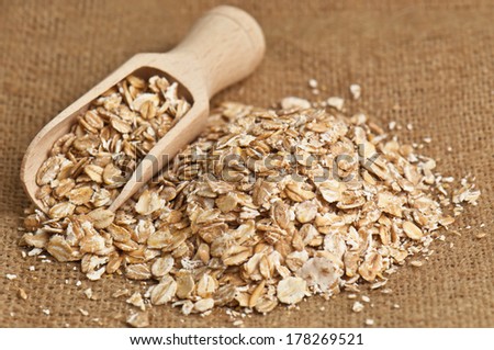 heap of oat flakes on burlap