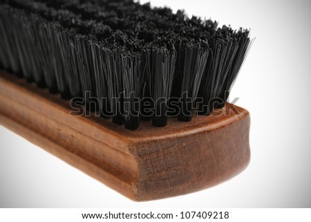 Closeup of wooden brush for cleaning clothes. isolated on white background